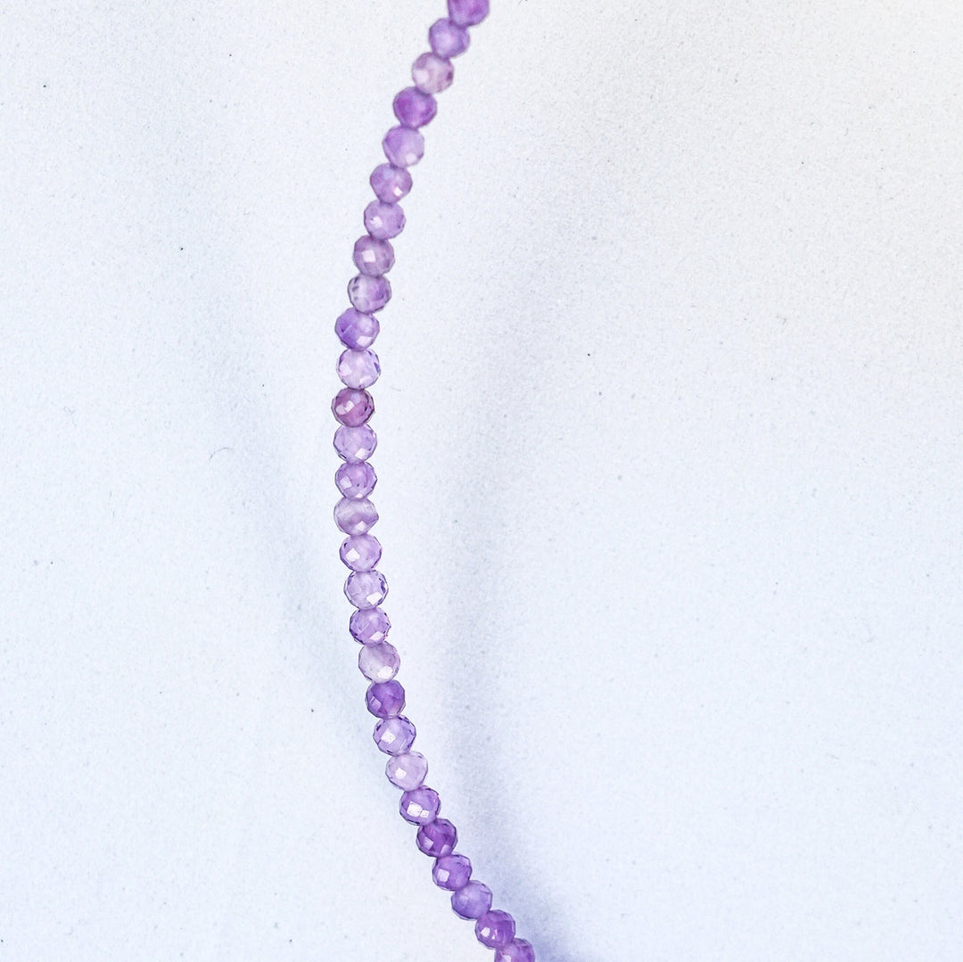 NAM025 Girocollo in acciaio chirurgico dorato e ametista