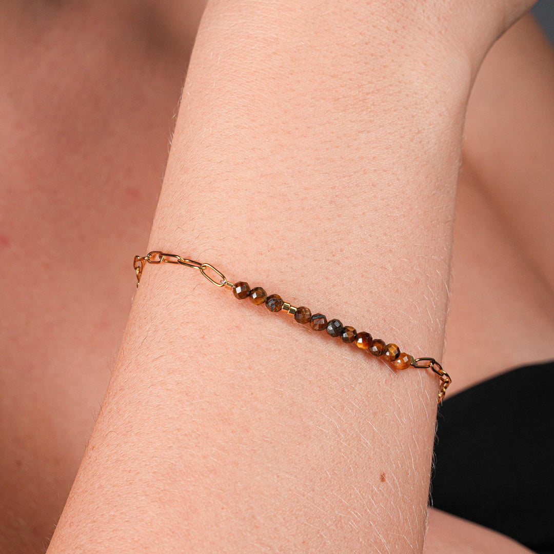 NAM014 Bracciale in acciaio chirurgico dorato e occhio di tigre